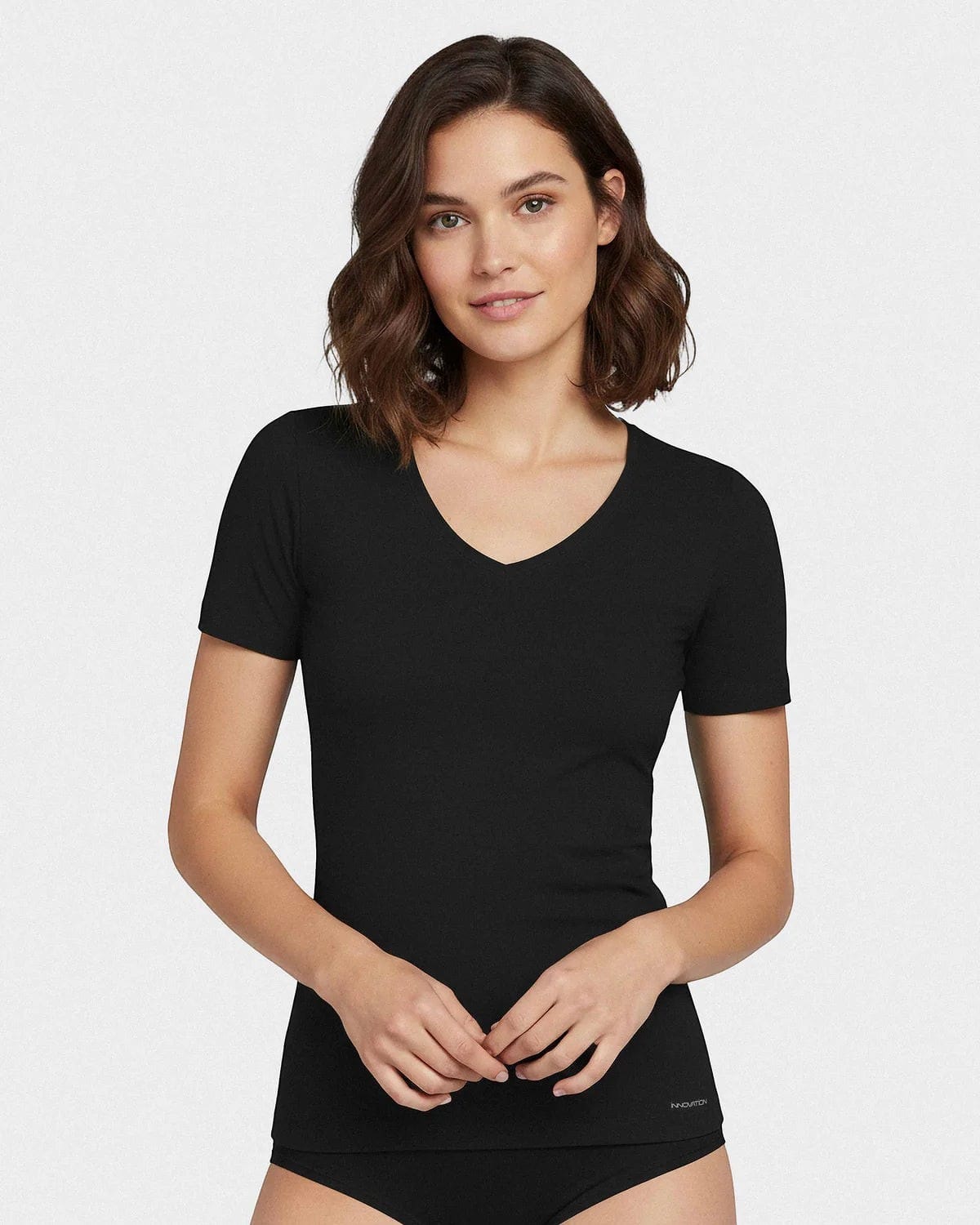 Maison Sarava black V-neck t-shirt made from cotton and viscose with Outlast® technology for temperature regulation.