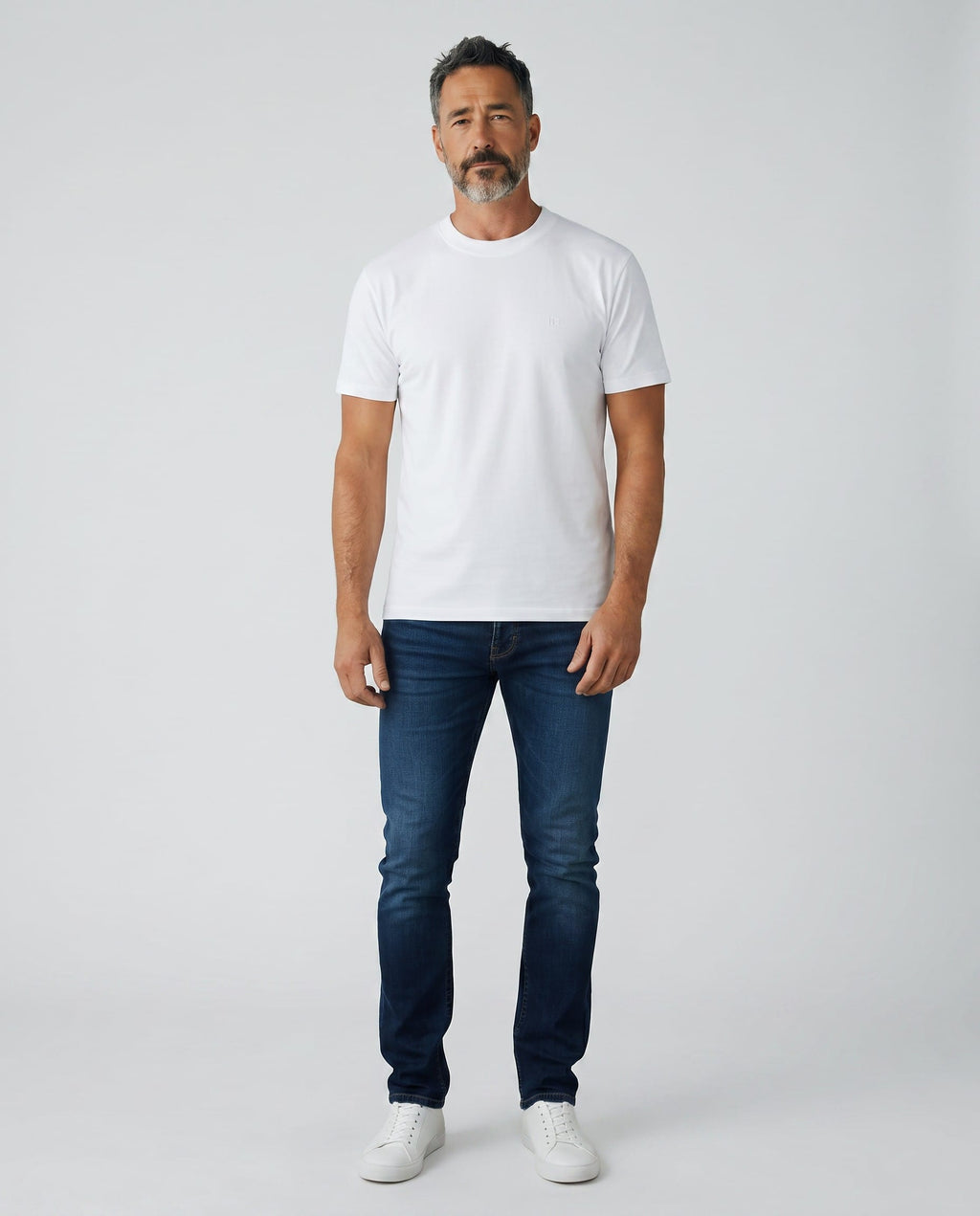 Maison Sarava white textured knit short sleeve crew neck sweater with subtle vertical texture and embroidered logo.