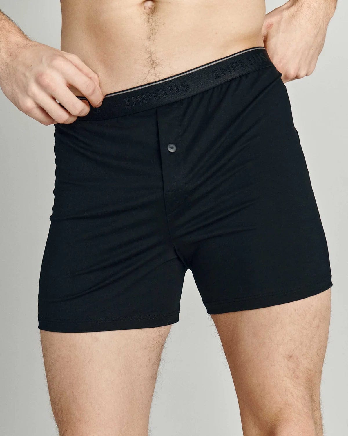 Maison Sarava black cotton boxer briefs with button fly and branded elastic waistband.