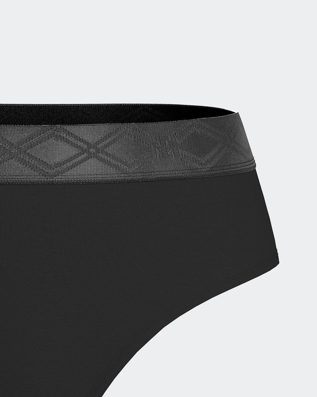 Maison Sarava black thong made from TENCEL™ Lyocell with a satin elasticated waistband featuring a subtle geometric pattern.