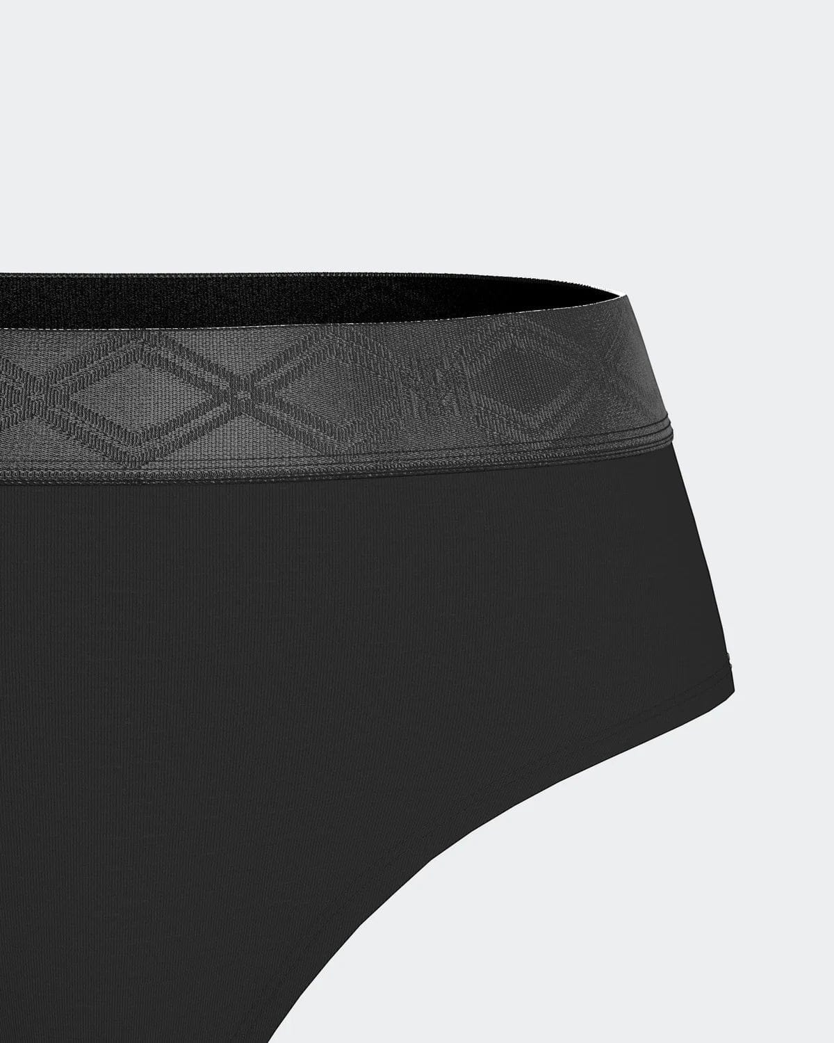 Maison Sarava black thong made from TENCEL™ Lyocell with a satin elasticated waistband featuring a subtle geometric pattern.