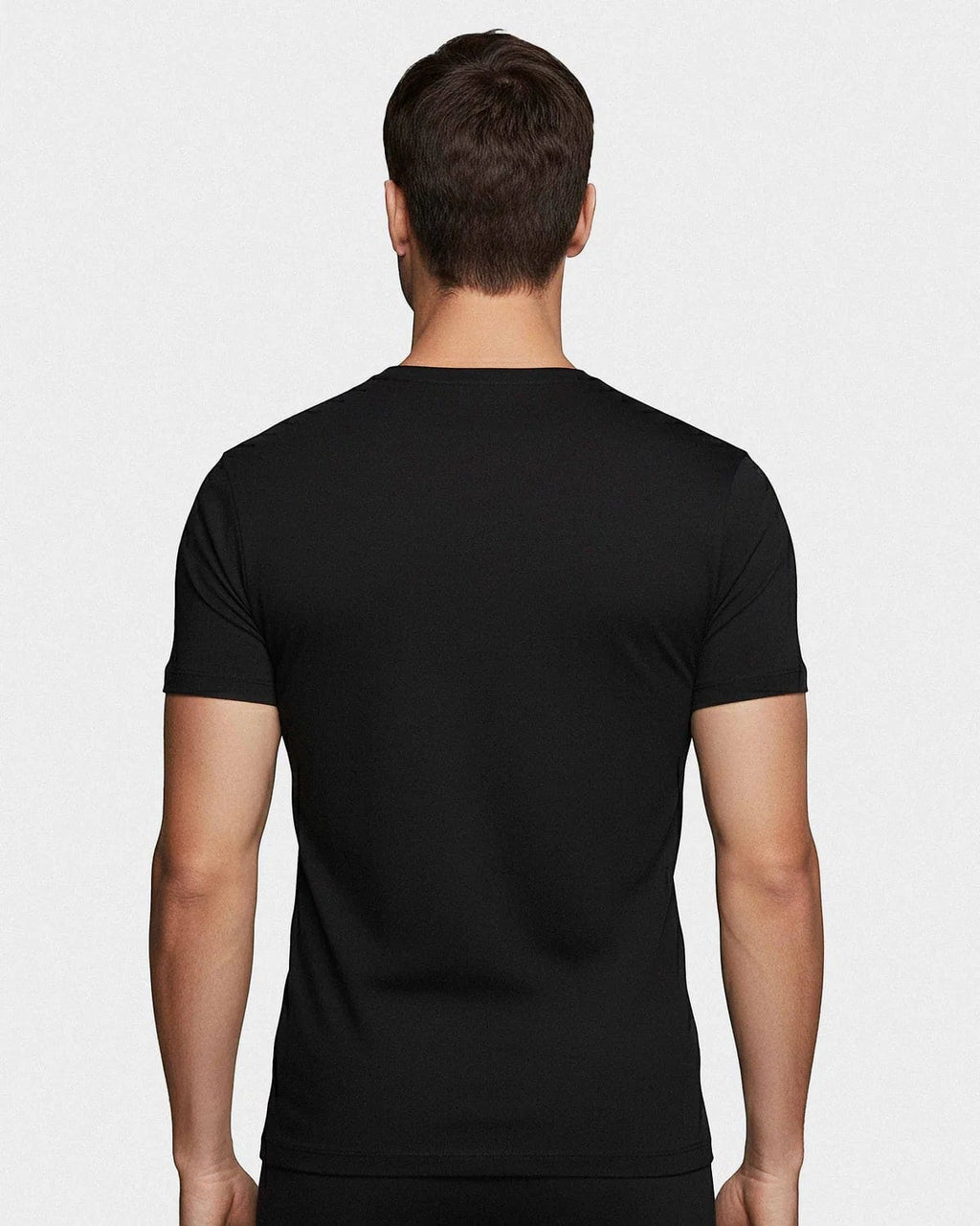 Maison Sarava black crew neck t-shirt made from soft cotton, shown from the back on a male model.