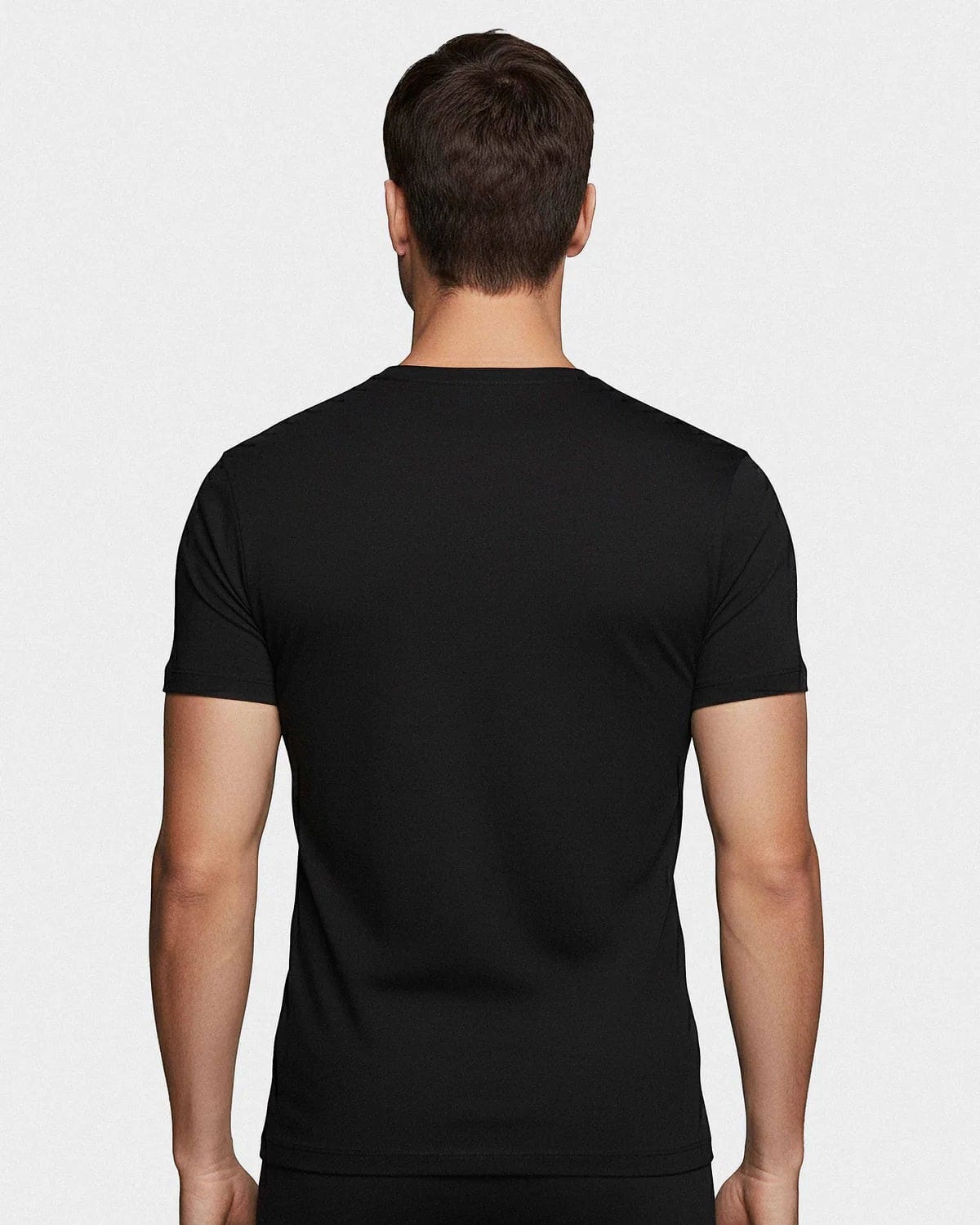 Maison Sarava black crew neck t-shirt made from soft cotton, shown from the back on a male model.