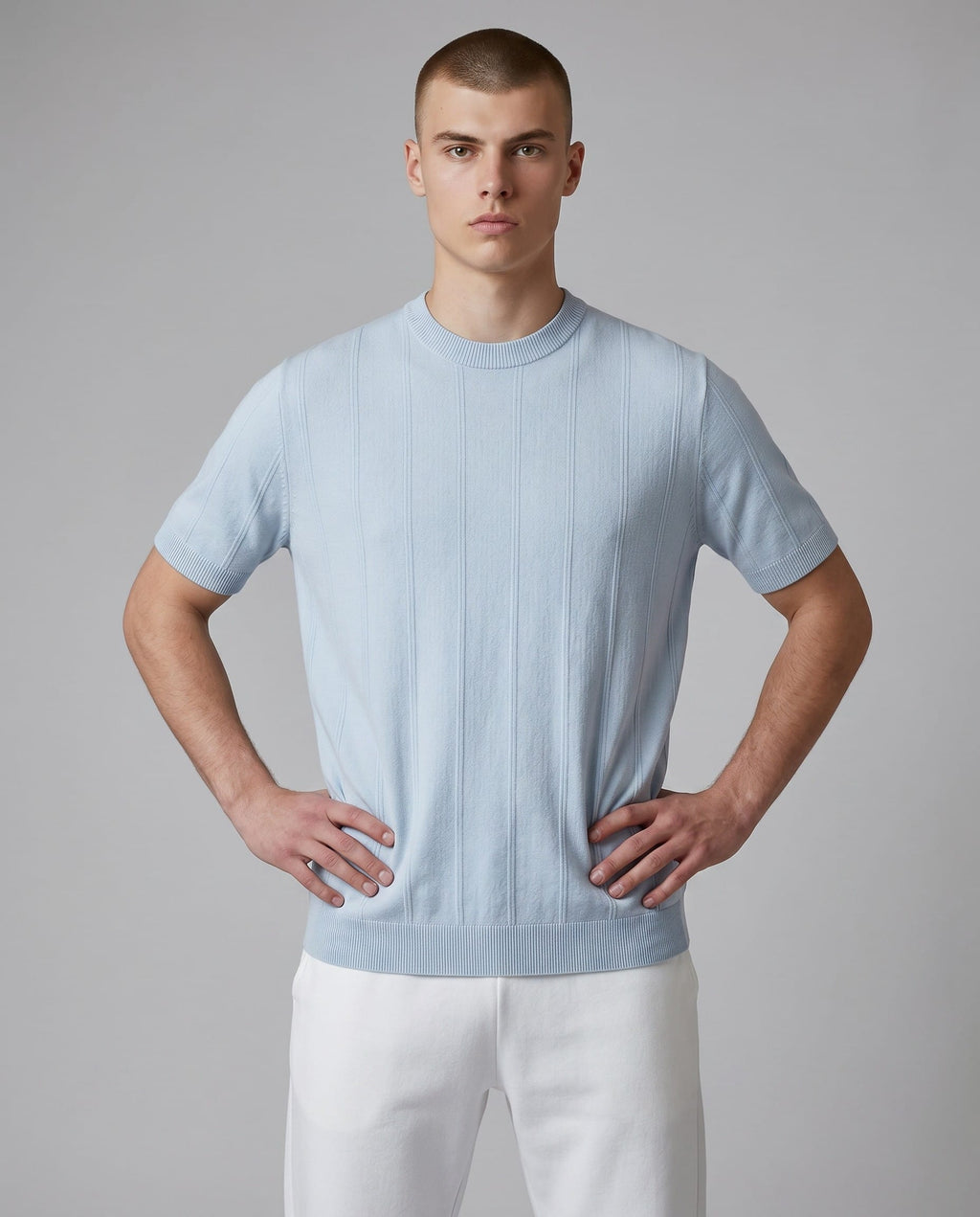 Maison Sarava light blue short-sleeved Tencel Lyocell t-shirt with a subtle vertical stripe texture and round neckline.