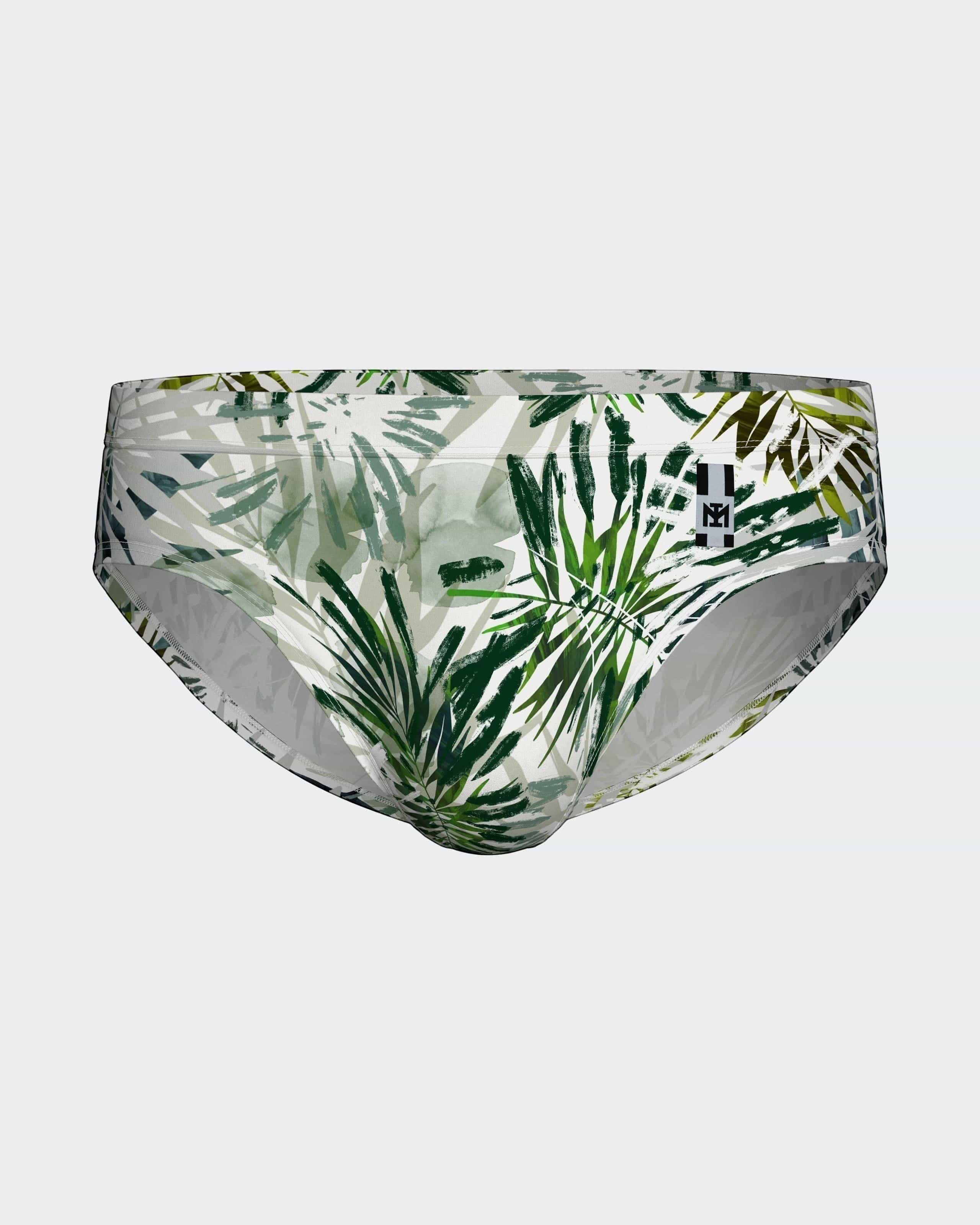 Maison Sarava tropical leaf print swim briefs in green and white. Form-fitting, quick-drying fabric.