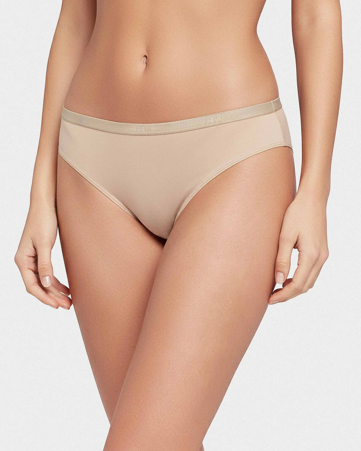 Maison Sarava women's beige thong underwear made from soft Lyocell with an elasticated waistband.