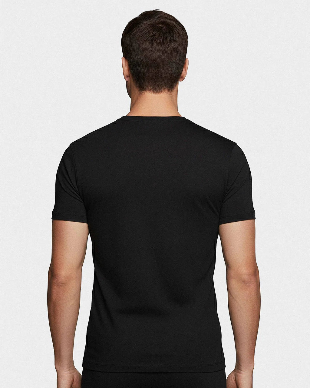 Maison Sarava black crew neck t-shirt made from soft cotton, shown from the back on a male model.