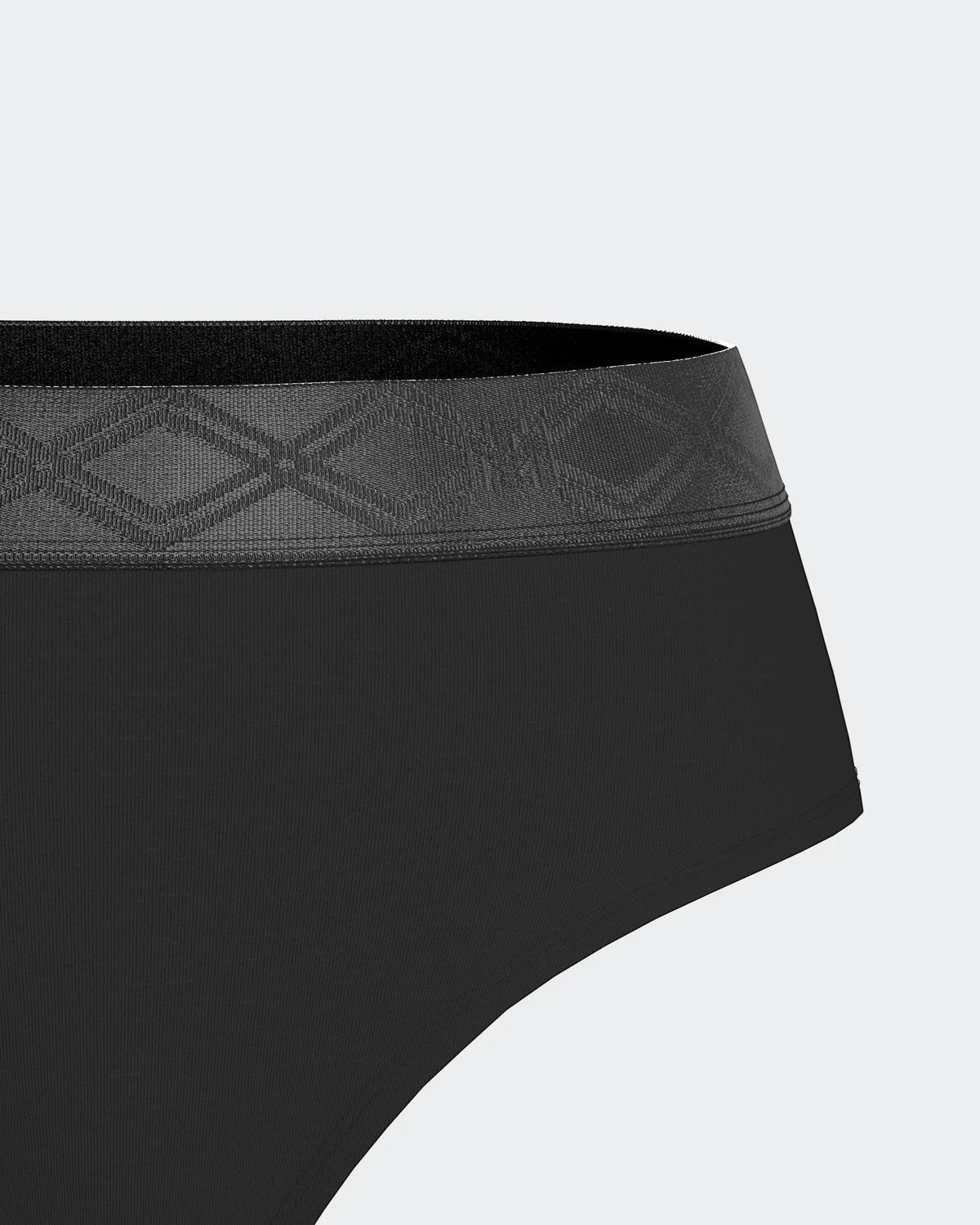 Maison Sarava black thong made from TENCEL™ Lyocell with a satin elasticated waistband featuring a subtle geometric pattern.