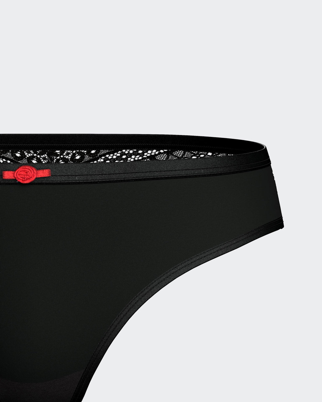 Maison Sarava black Lyocell thong with lace trim and red bow detail.