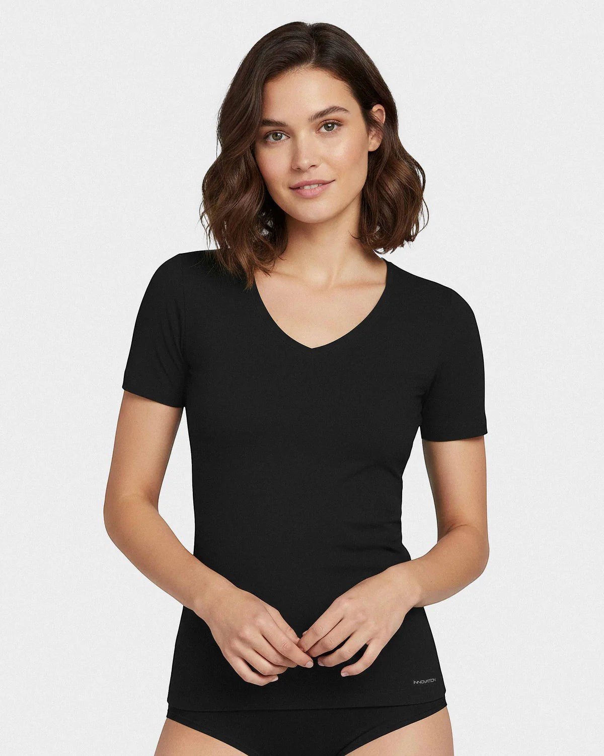 Maison Sarava black V-neck t-shirt made from cotton and viscose with Outlast® technology for temperature regulation.