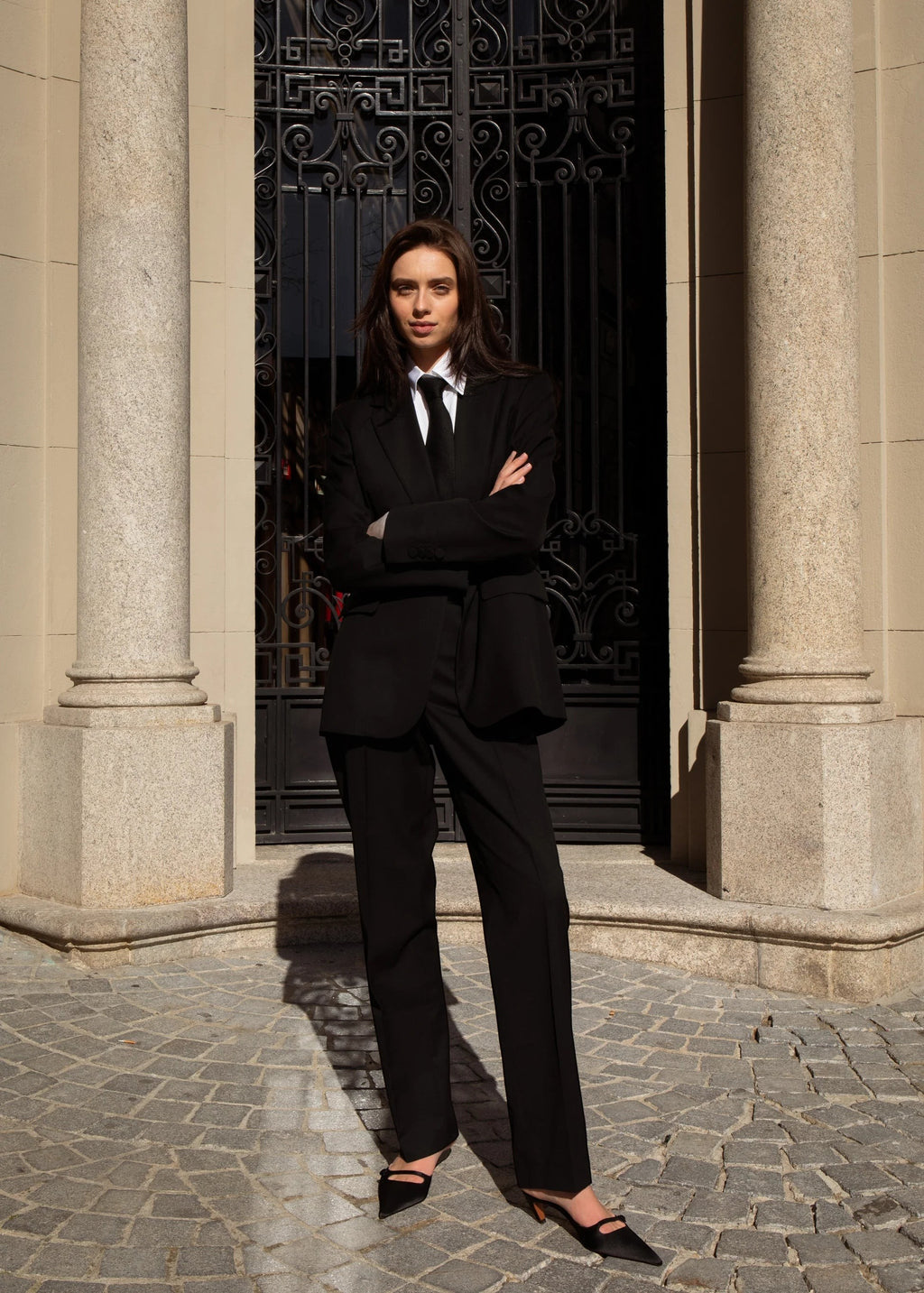 Maison Sarava black 100% wool single-breasted belted blazer with a tie and semi-notched lapel.
