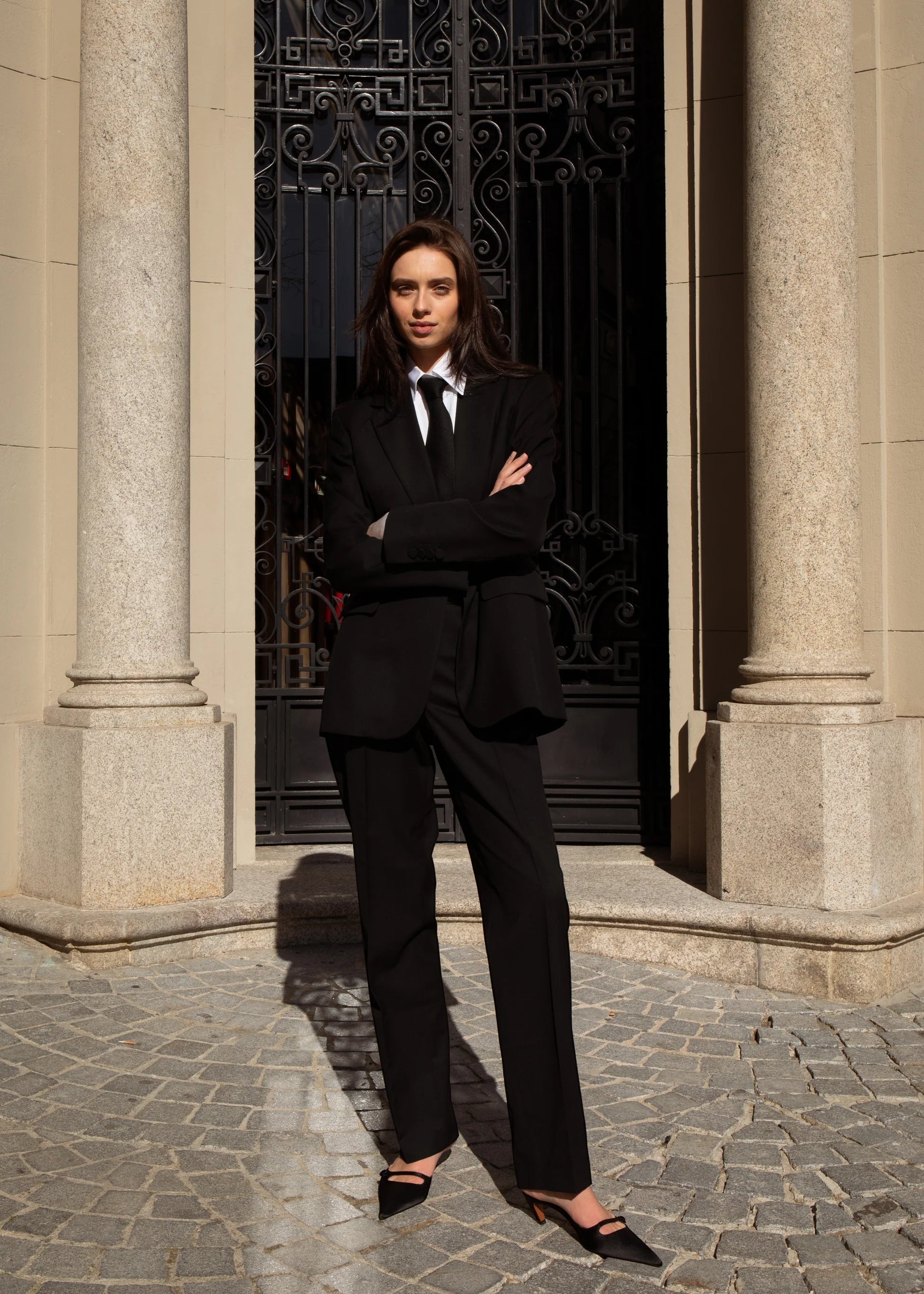 Maison Sarava black 100% wool single-breasted belted blazer with a tie and semi-notched lapel.