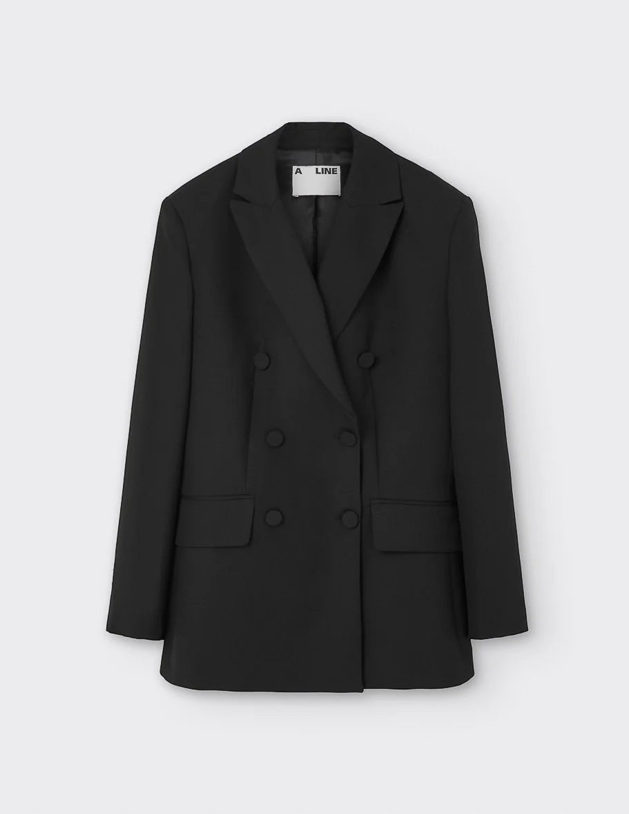 Maison Sarava women's black wool double-breasted blazer with peak lapels and two front flap pockets.