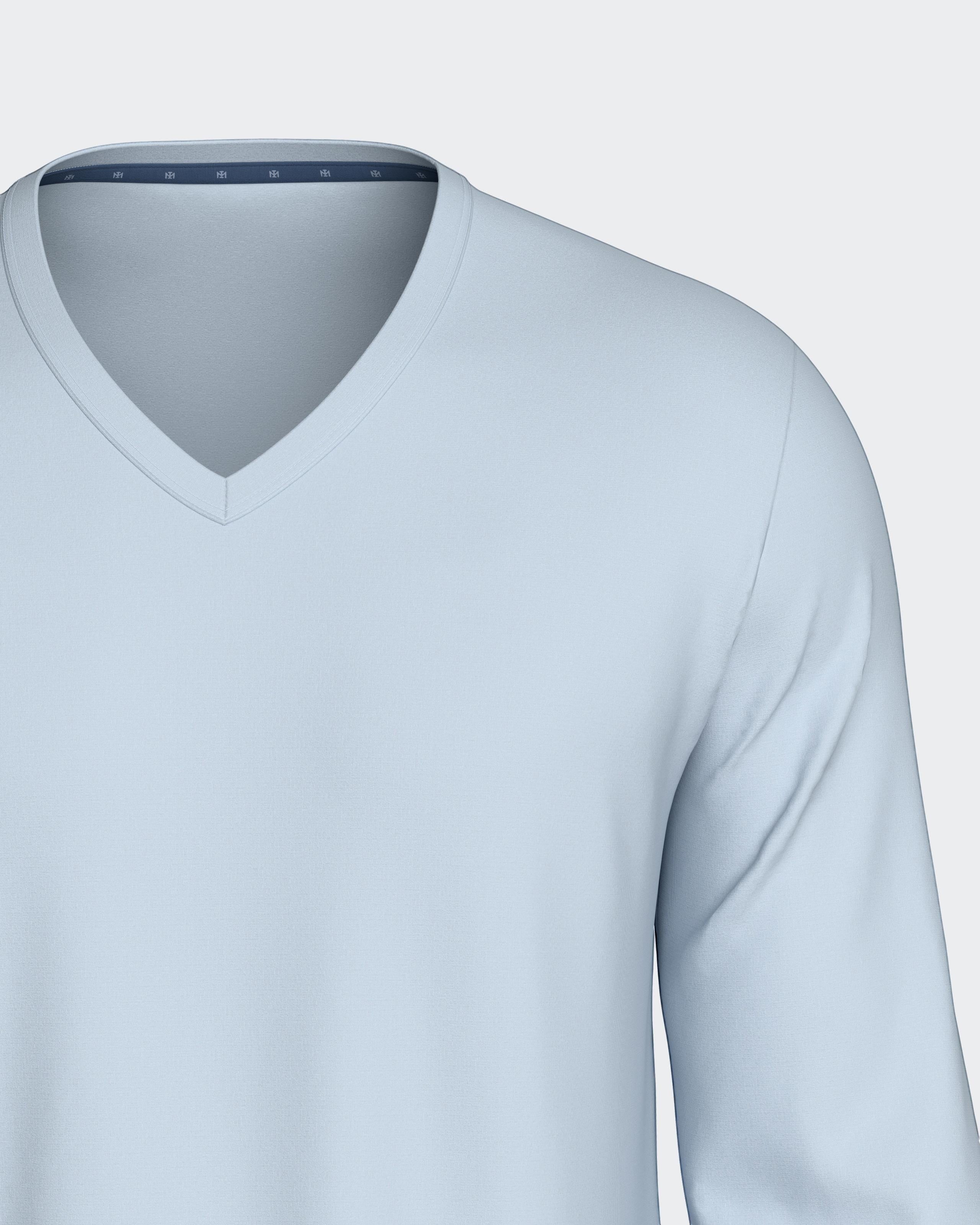 Maison Sarava light blue V-neck long sleeve top with subtle chest embroidery, part of a cotton and TENCEL Modal lounge set.