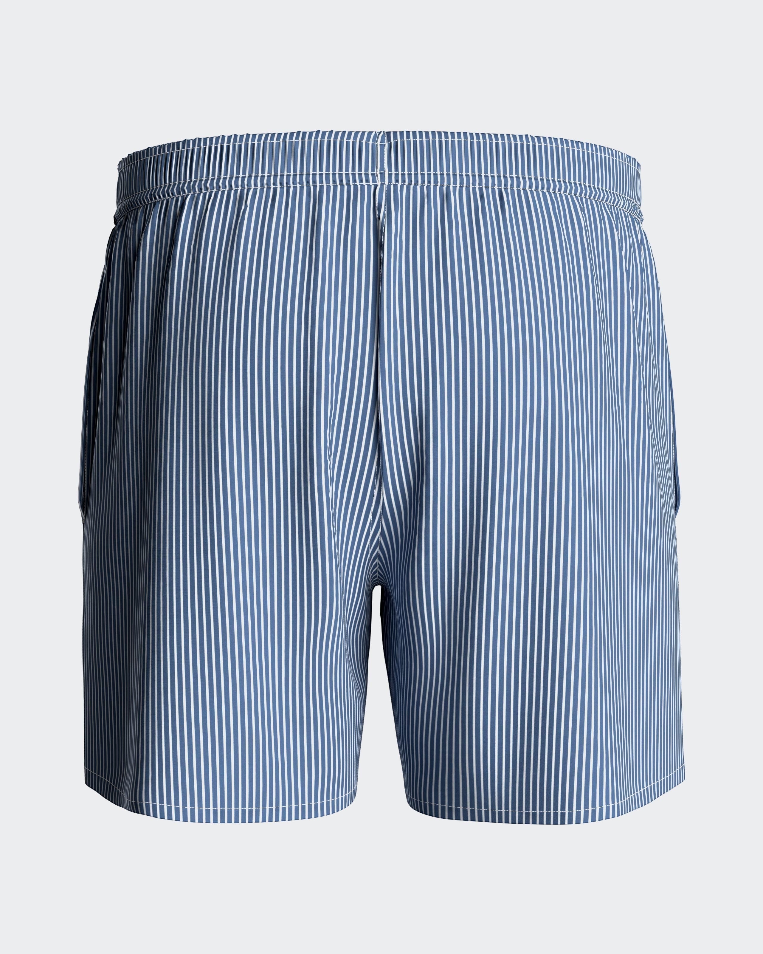Maison Sarava blue and white striped men's swim shorts with drawstring, side pockets and back velcro pocket.