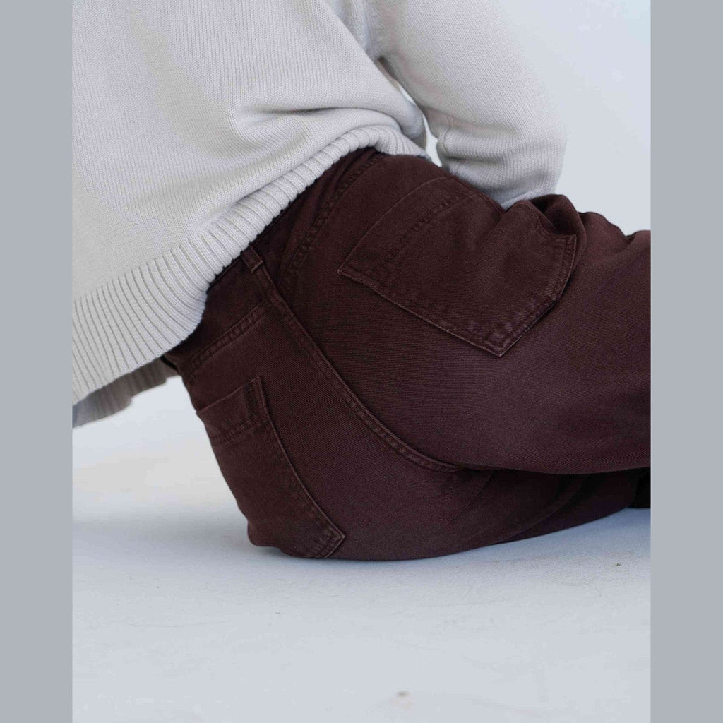Maison Sarava brown denim Elsa trousers with high rise waist and wide leg silhouette.
