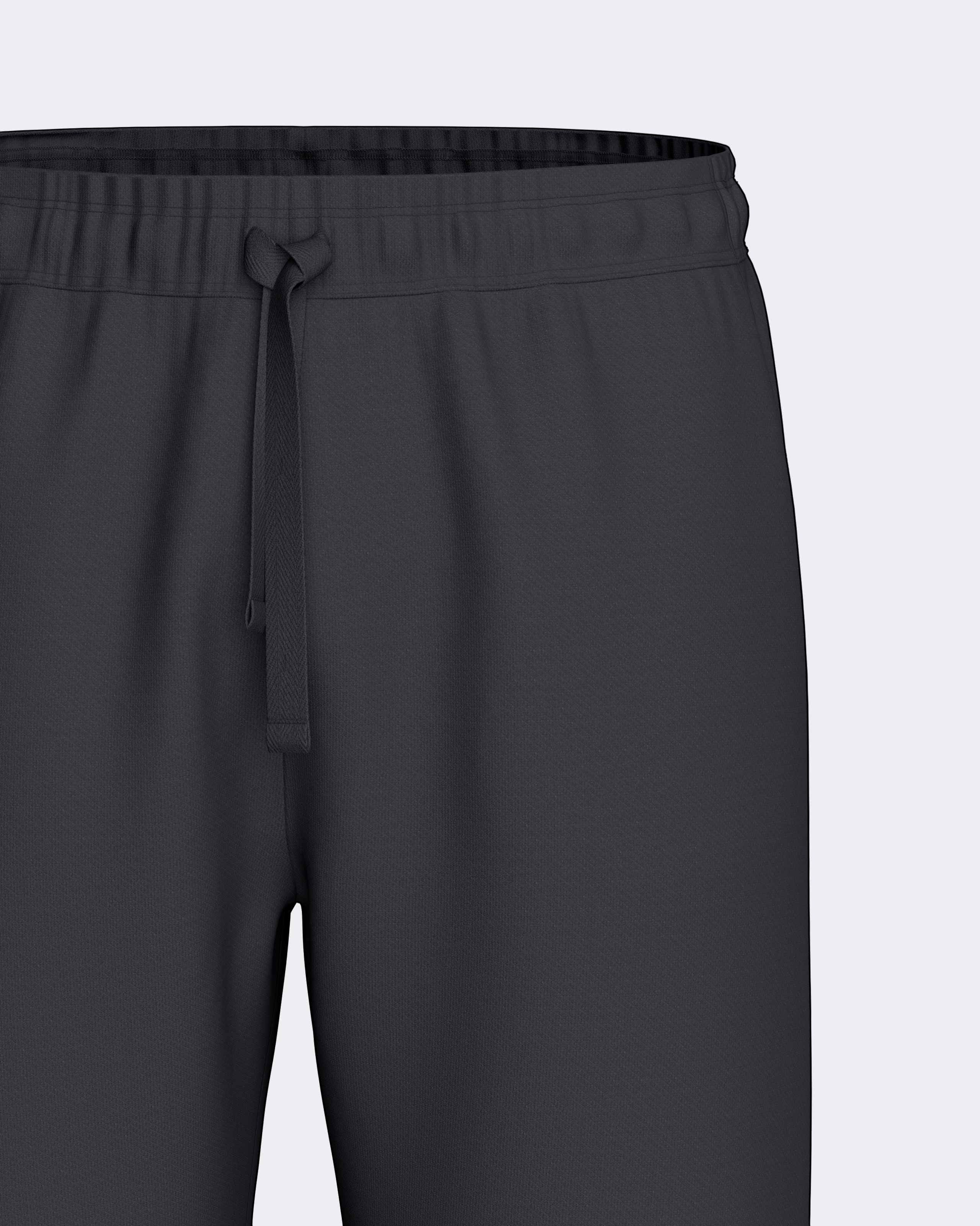 Maison Sarava dark grey lounge pants with drawstring waist and relaxed fit, made from soft breathable fabric.