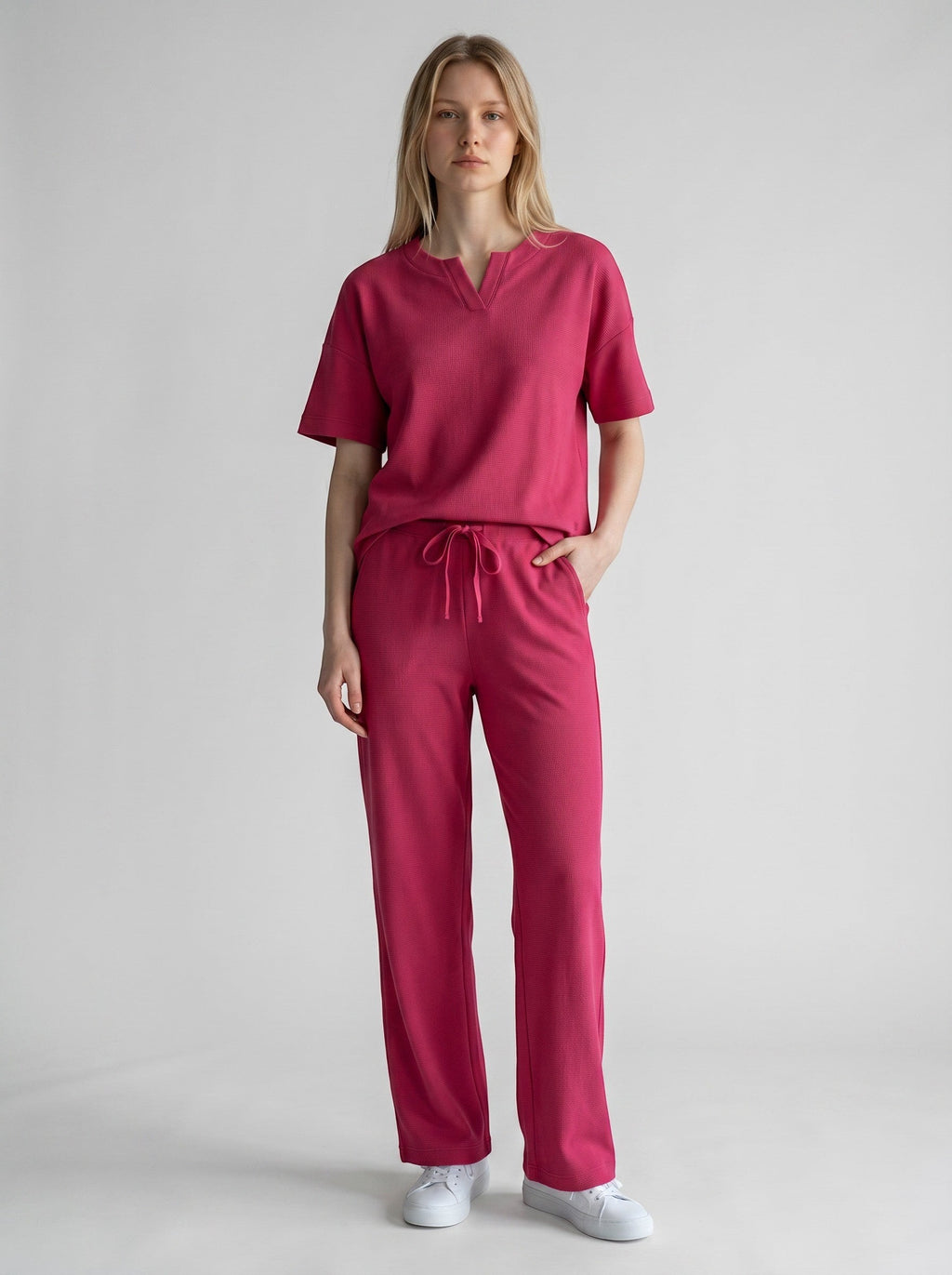 Maison Sarava women's fuchsia lyocell lounge set with v-neck top and drawstring pants.