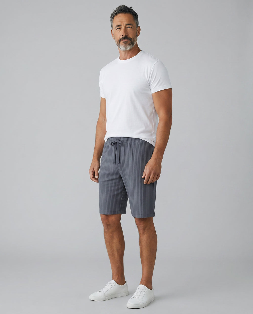 Maison Sarava men's grey Bermuda shorts with a modern fit, drawstring waist, and vertical stripe texture. Made in Portugal.
