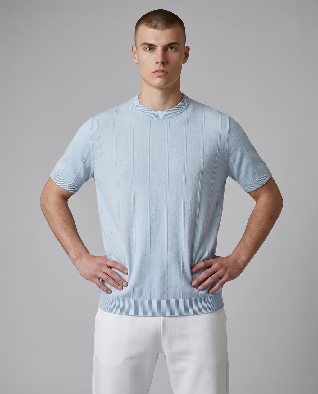 Maison Sarava light blue short-sleeved Tencel Lyocell t-shirt with a subtle vertical stripe texture and round neckline.