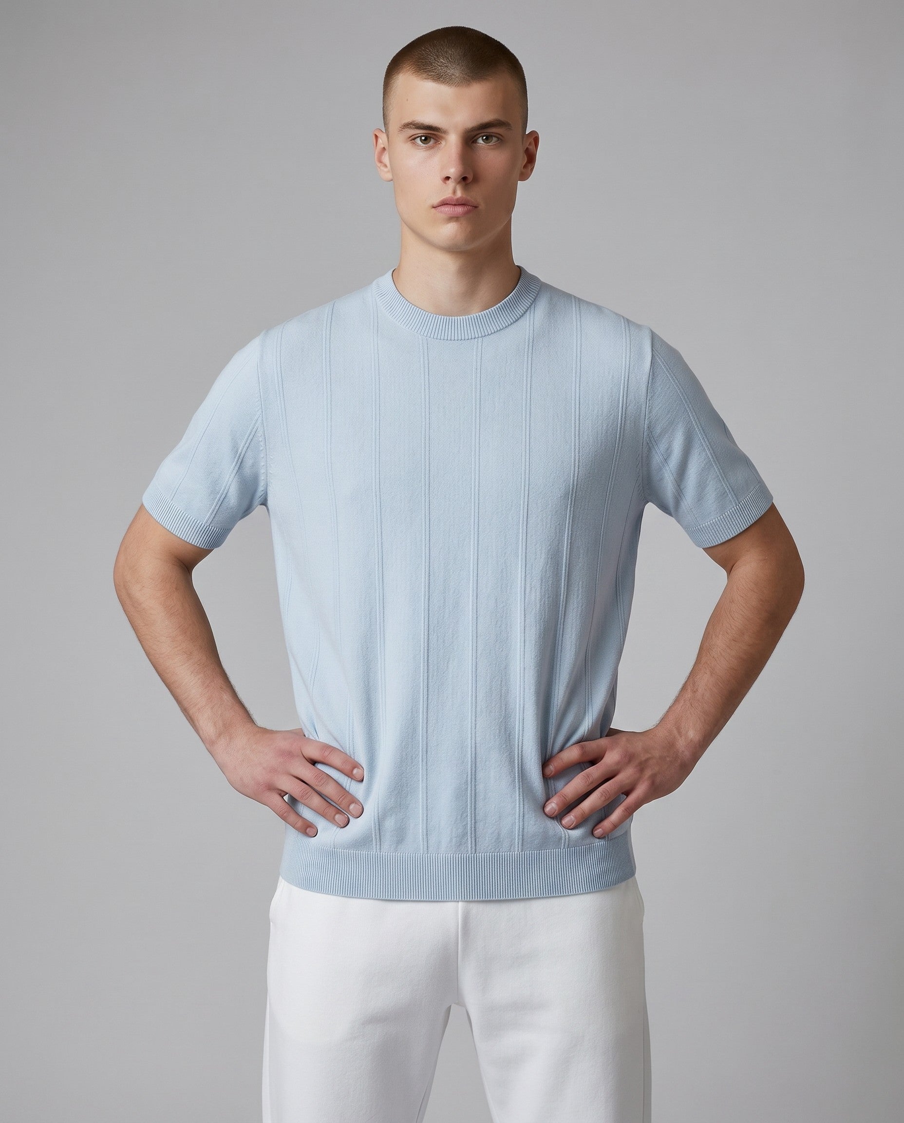 Maison Sarava light blue short-sleeved Tencel Lyocell t-shirt with a subtle vertical stripe texture and round neckline.
