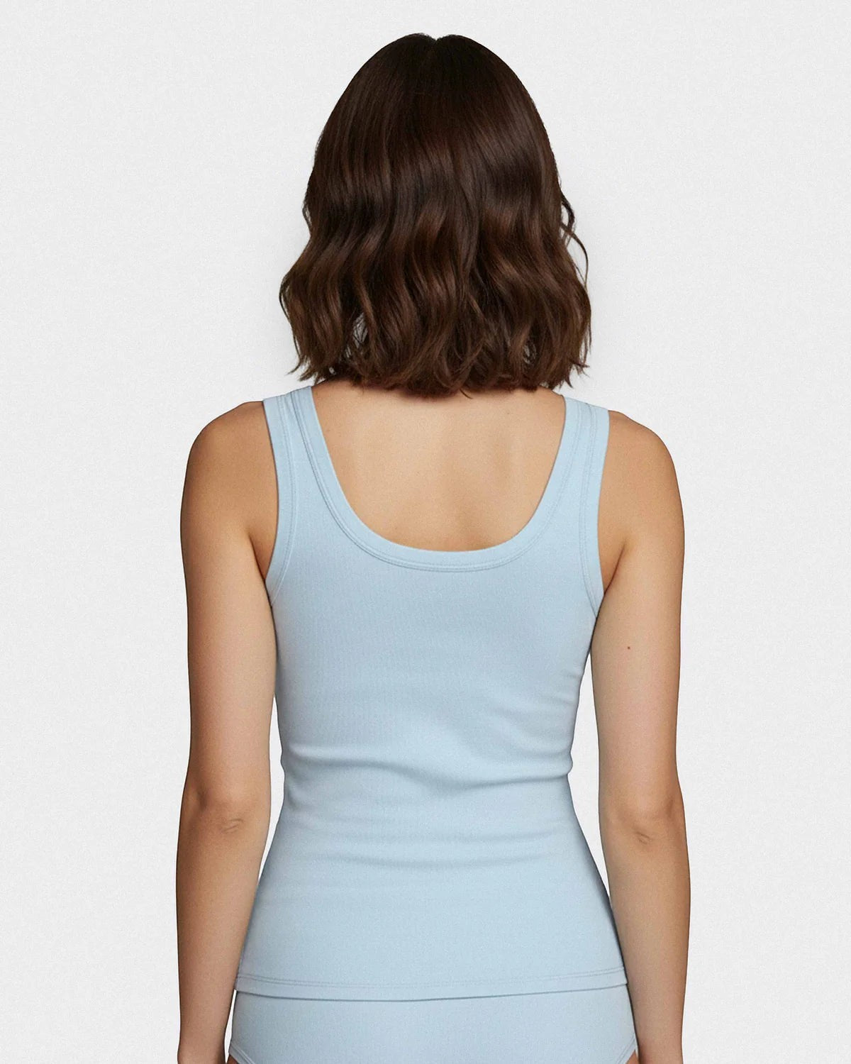 Maison Sarava light blue ribbed Lyocell tank top with wide straps, worn by a model.