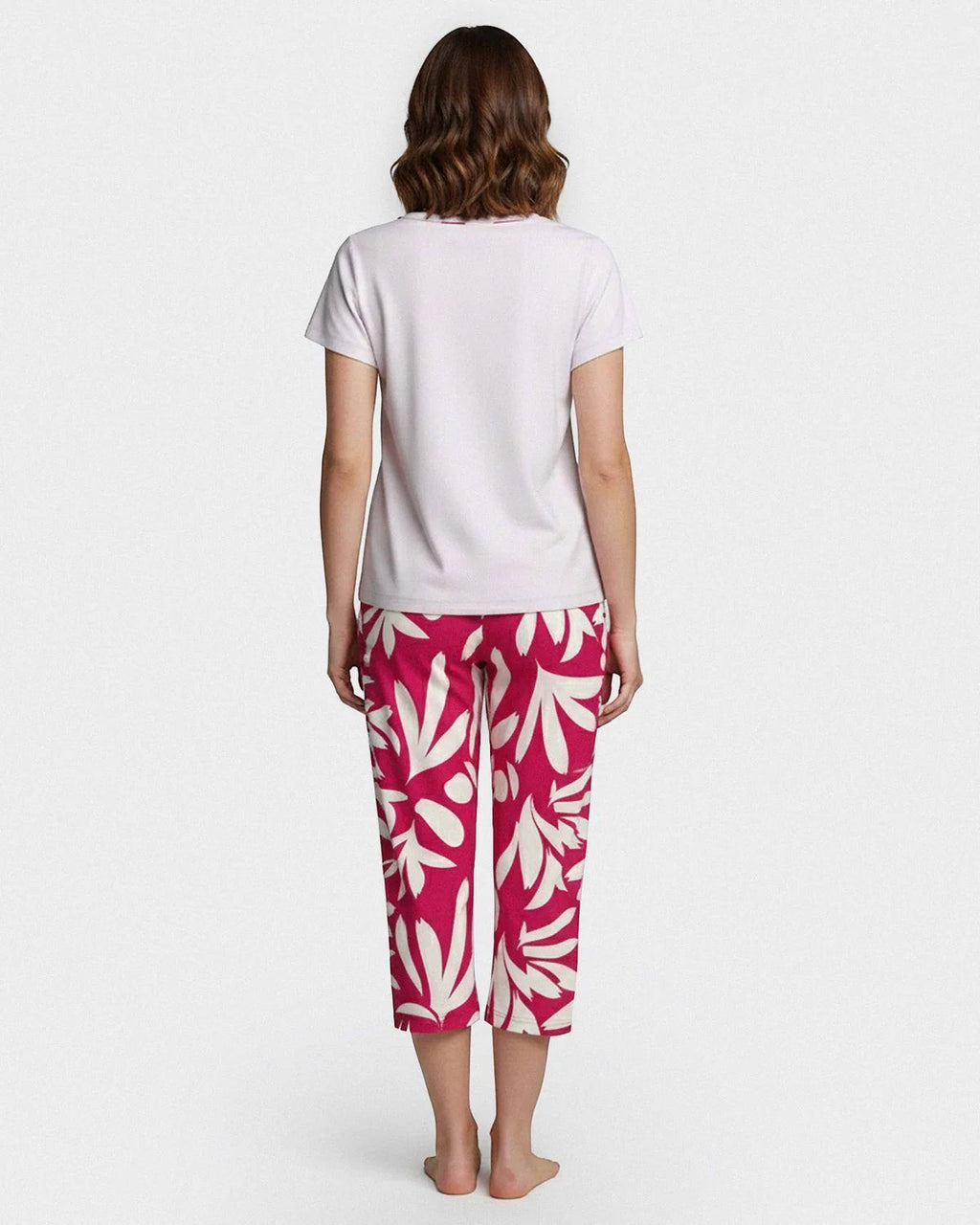 Maison Sarava women's white short-sleeve top and pink floral print capri lounge pants made from Lyocell.