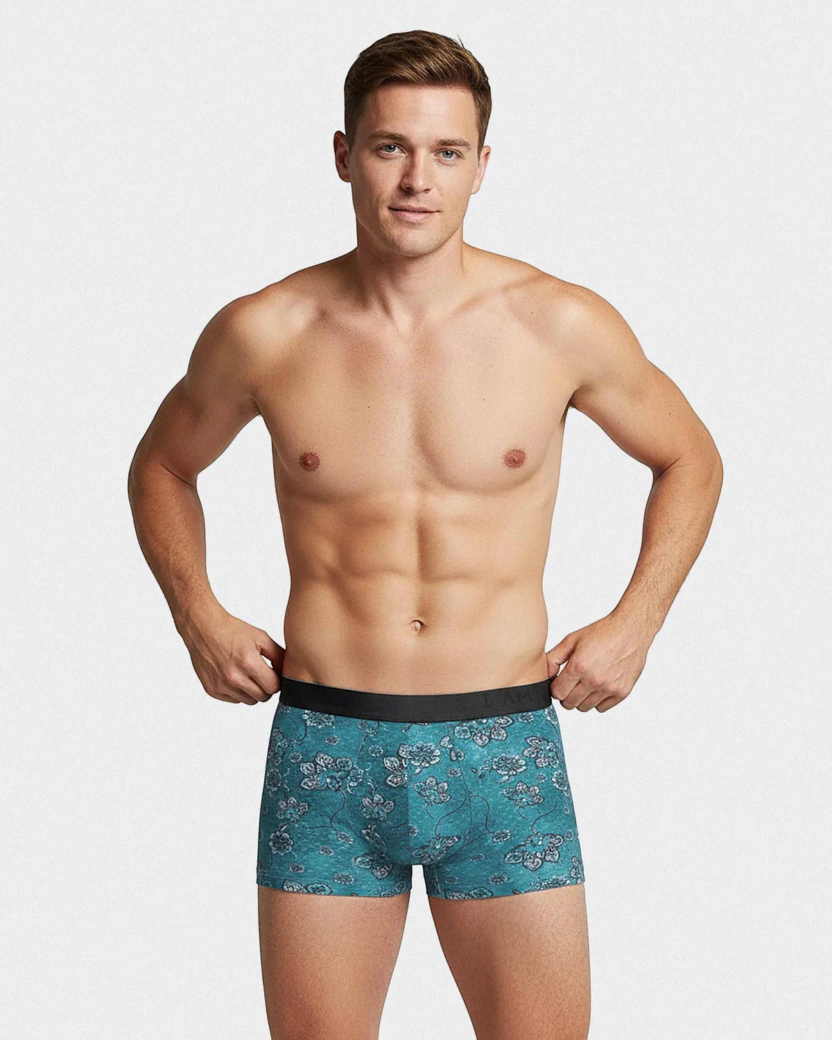 Maison Sarava men's boxer briefs in teal with a floral print and black elastic waistband. Made from Tencel Lyocell.