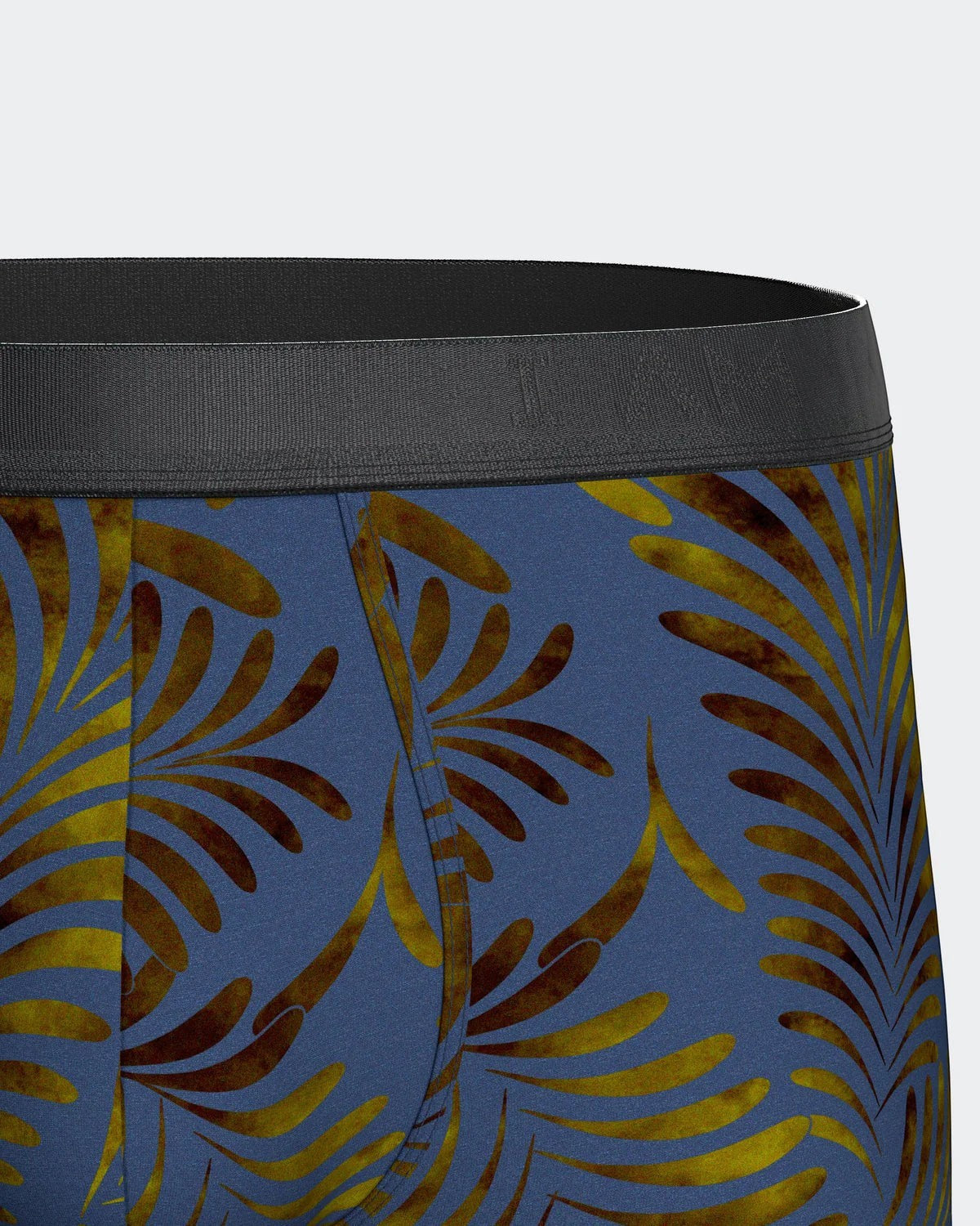 Maison Sarava men's blue boxer briefs with a tropical leaf print in gold and brown, made from TENCEL Lyocell.