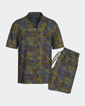 Maison Sarava men's blue lyocell lounge set with tropical leaf print, short sleeves, lapel collar, and drawstring shorts.