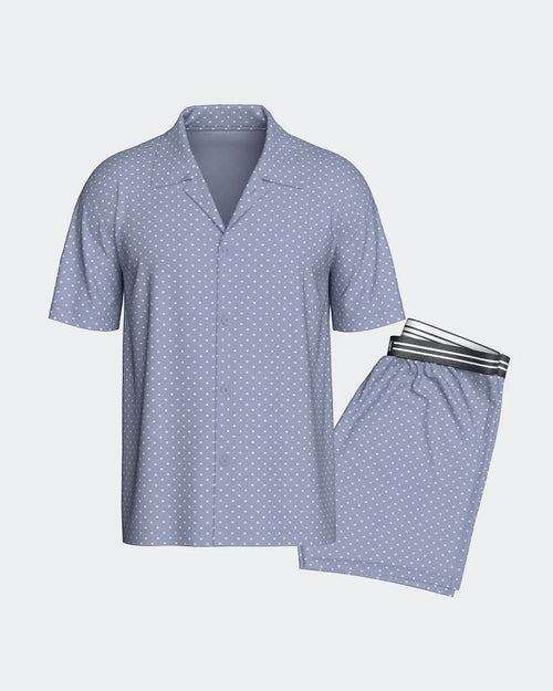 Maison Sarava men's light blue cotton lounge set with white polka dots. Short sleeve button-up shirt and elastic waist shorts.