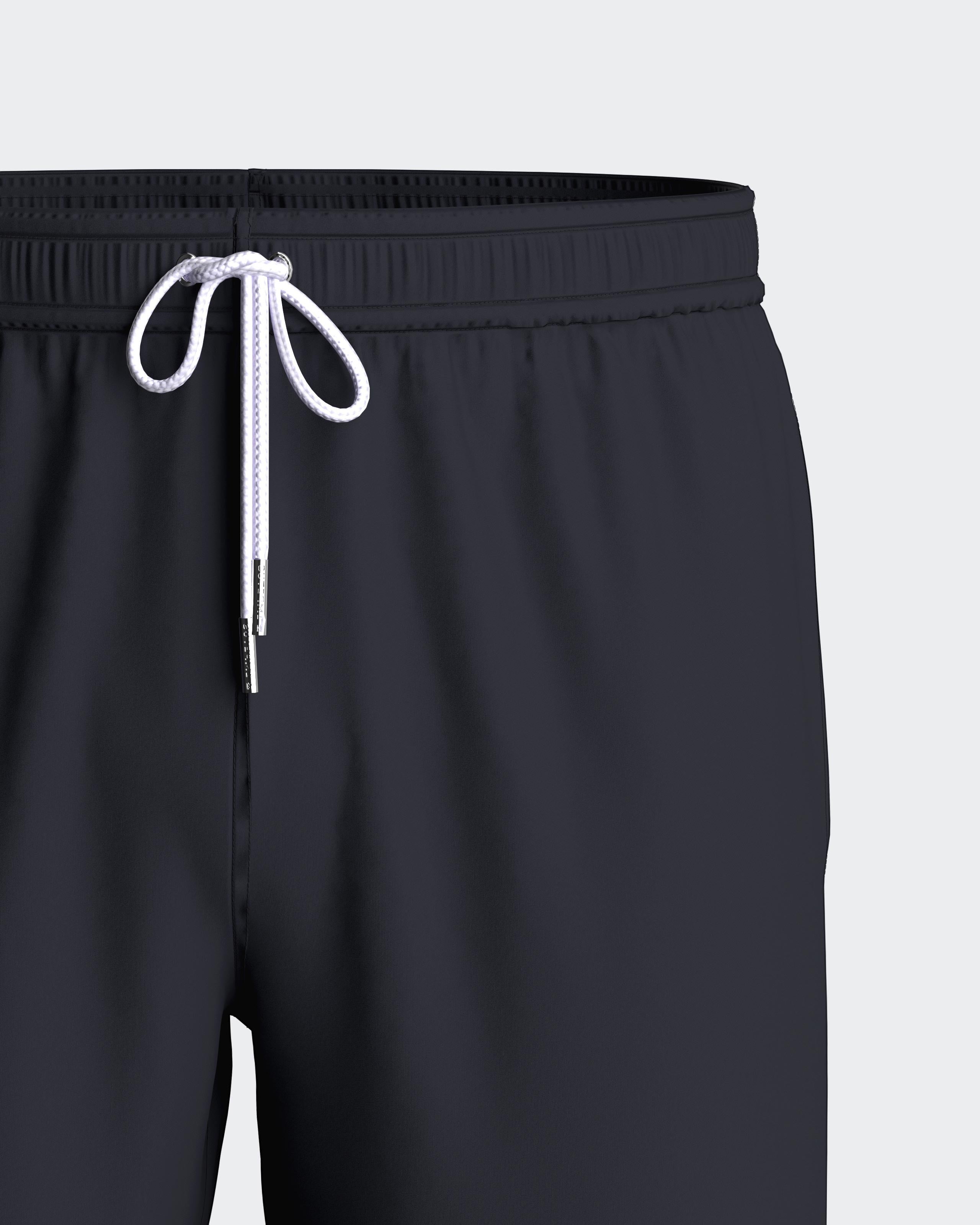 Maison Sarava men's dark navy polyester swim shorts with adjustable drawstring waist and side pockets.