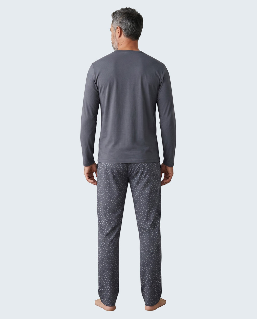 Maison Sarava men's dark grey long sleeve V-neck pajama set with patterned pants.