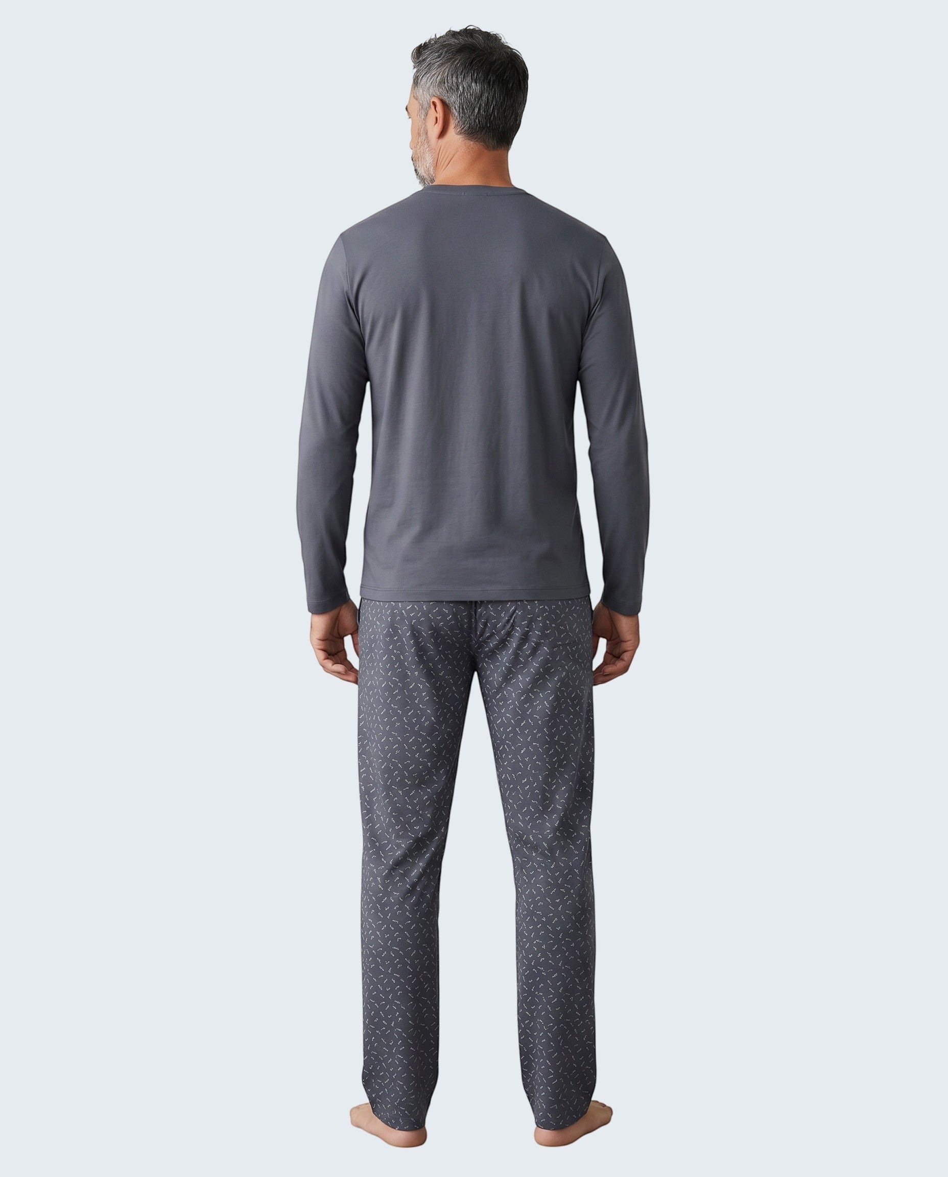 Maison Sarava men's dark grey long sleeve V-neck pajama set with patterned pants.
