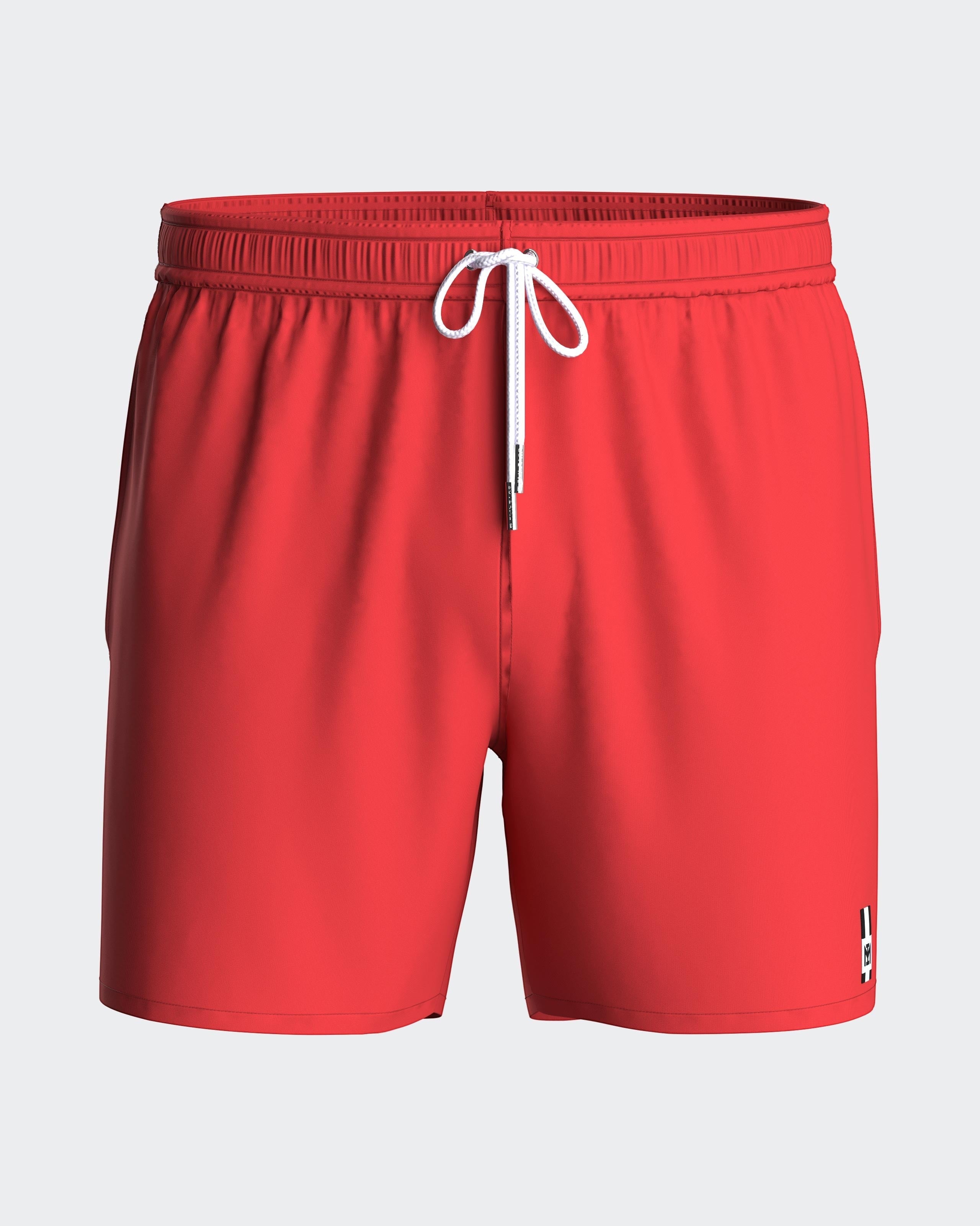 Maison Sarava red polyester men's swim shorts with adjustable drawstring waist and side slits.