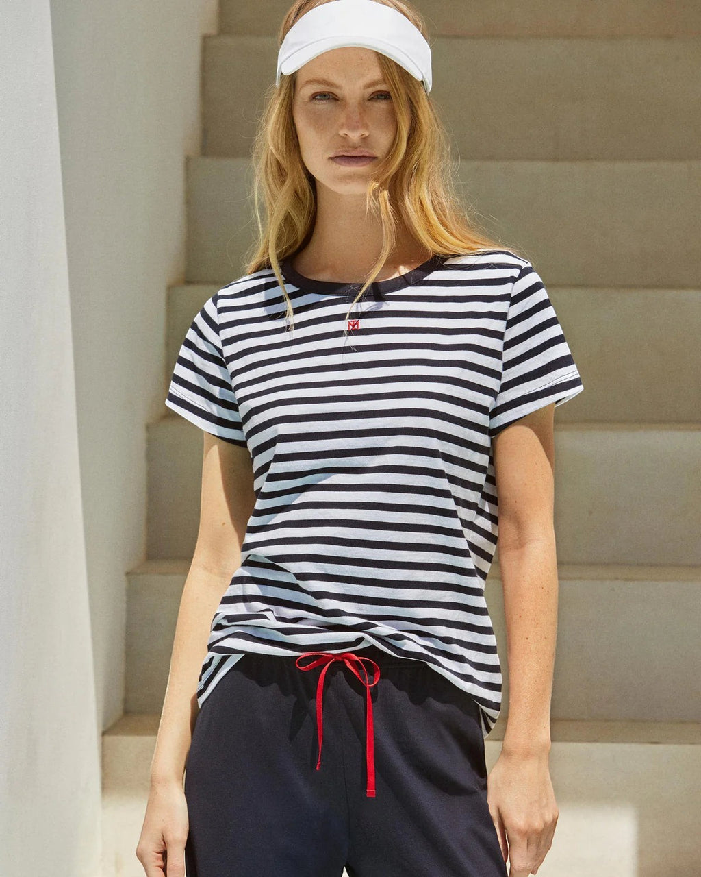Maison Sarava women's navy and white striped cotton short sleeve lounge set with navy capri trousers and red drawstring.